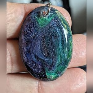 Hand Crafted resin necklace.purple, blue ,green 18 inch leather cord with 2 inch